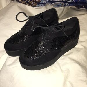 Black, glittery platform shoes